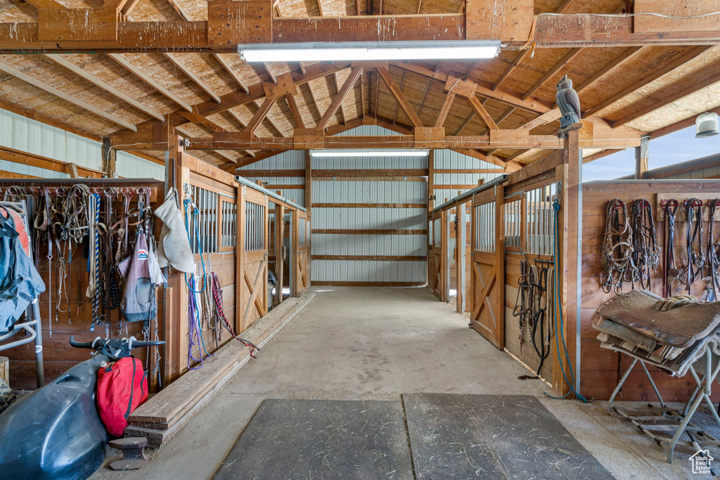 View of horse barn featuring an outdoor structure