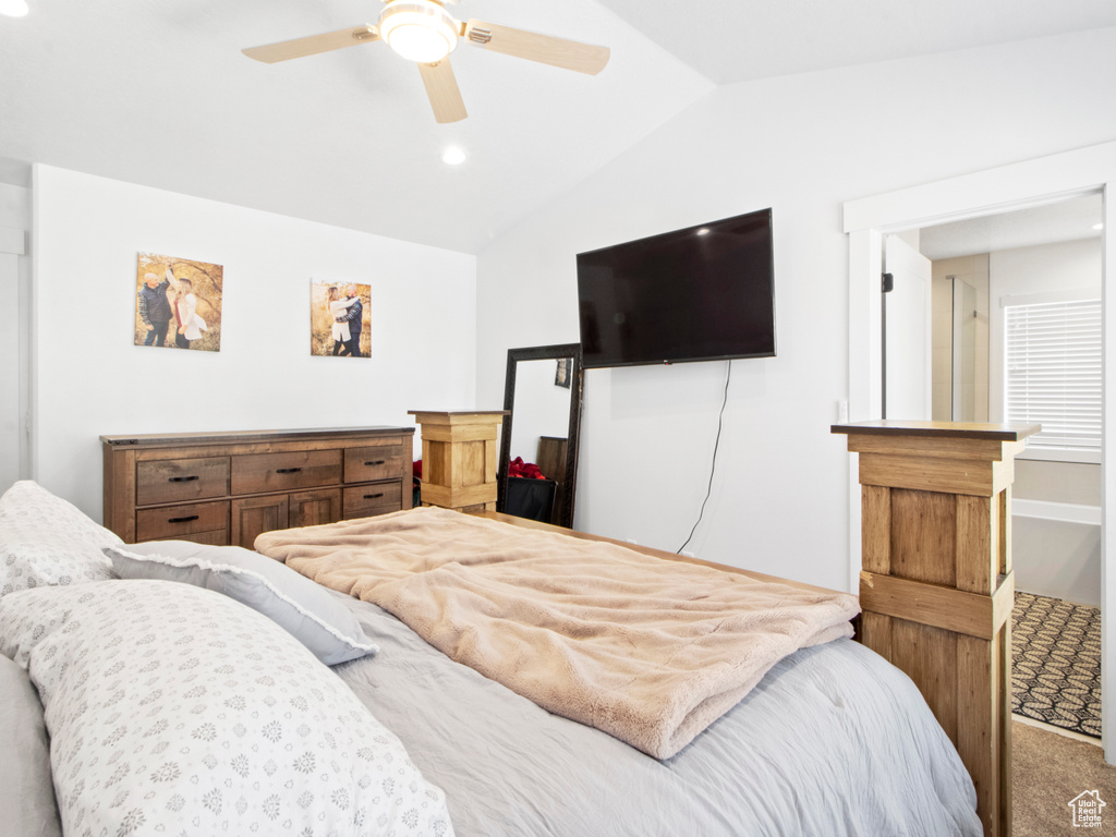 Bedroom featuring ceiling fan, carpet floors, and lofted ceiling