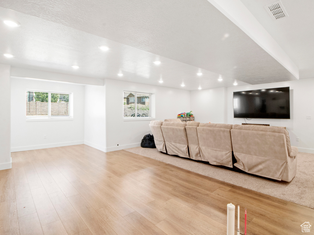 Living room featuring plenty of natural light and light hardwood / wood-style floors