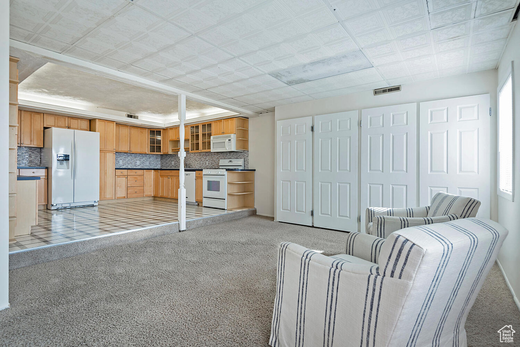Unfurnished living room with light tile floors