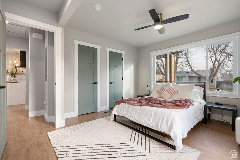 Bedroom featuring light hardwood / wood-style flooring and ceiling fan
