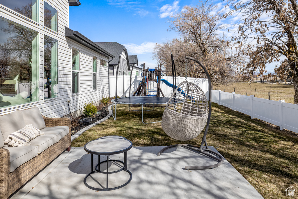 View of patio / terrace with a playground and a trampoline