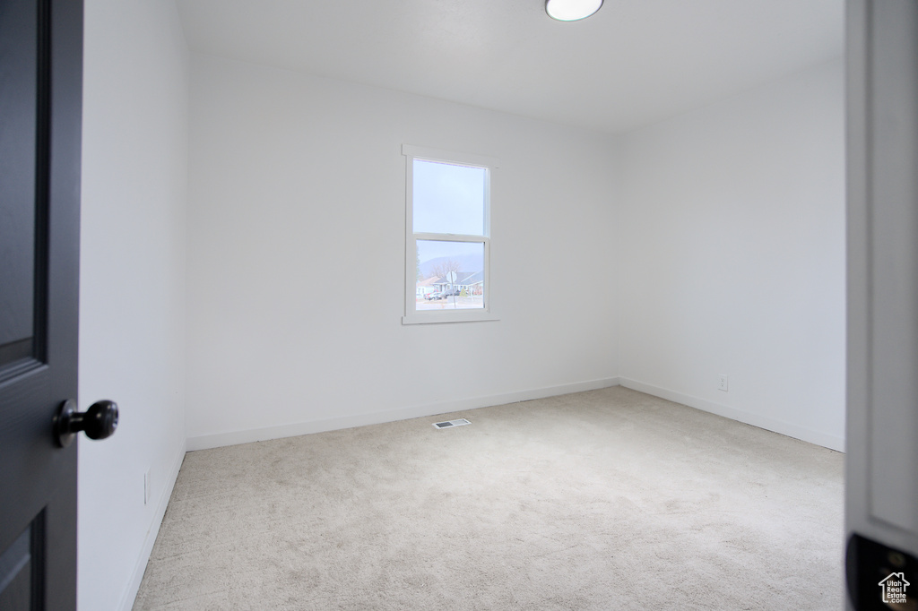Spare room with light carpet