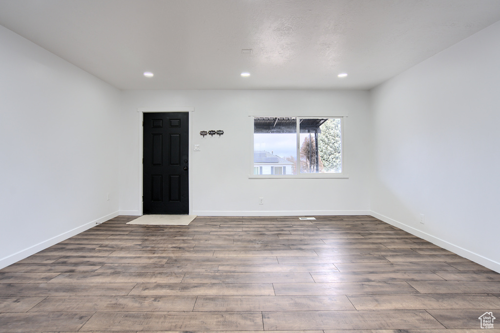 Spare room featuring hardwood / wood-style flooring