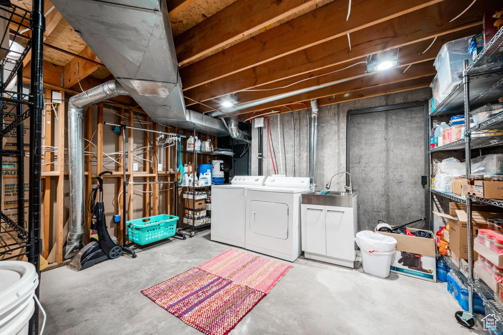 Basement with washer and dryer and sink