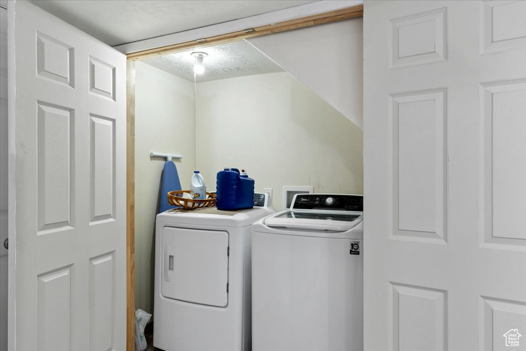 Laundry area featuring hookup for a washing machine and separate washer and dryer