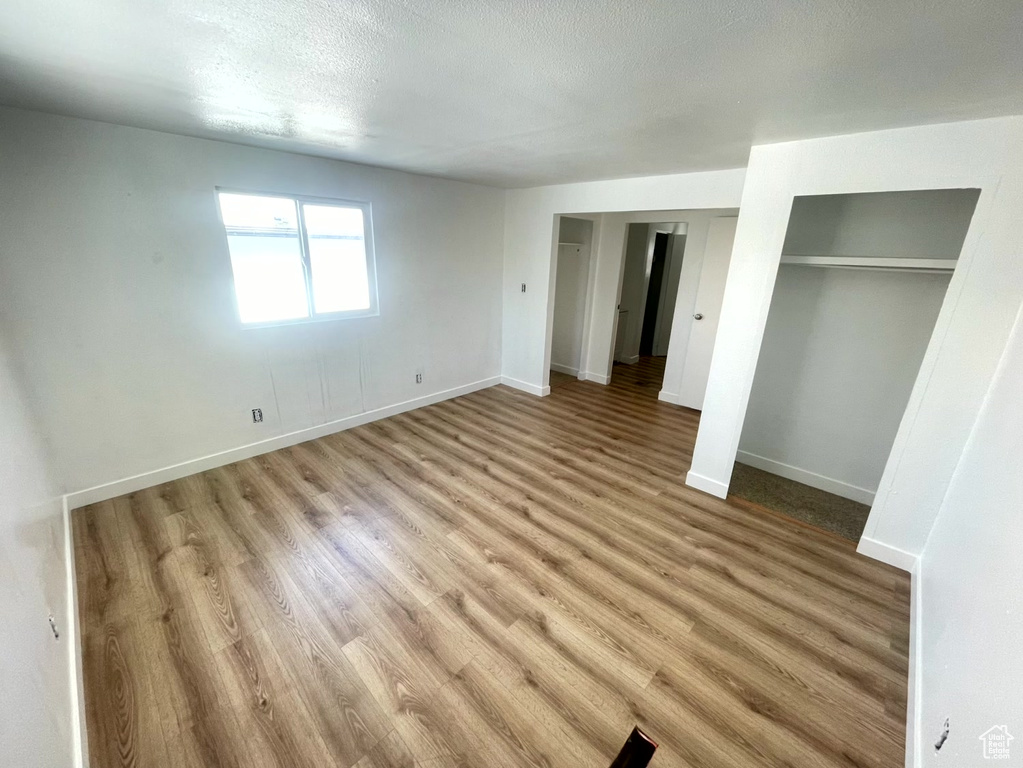 Unfurnished bedroom featuring light wood-type flooring