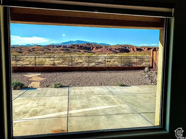 Doorway to outside featuring a mountain view