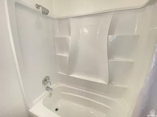 Bathroom with shower / washtub combination