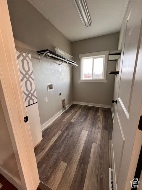 Washroom featuring dark wood-type flooring, electric dryer hookup, and washer hookup