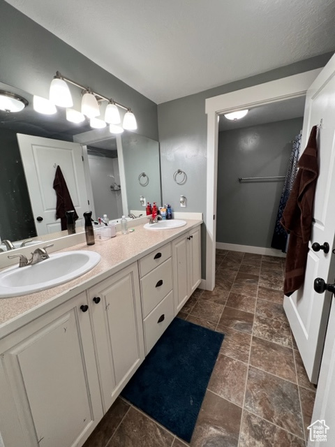 Bathroom with tile floors and double vanity