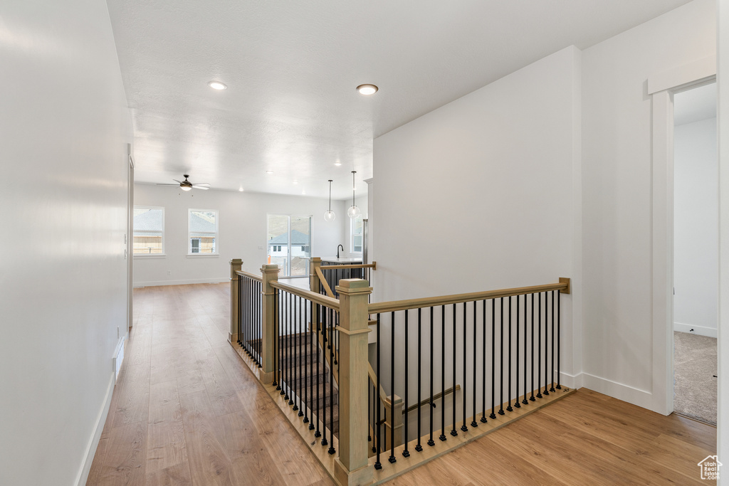 Hallway featuring light wood-type flooring