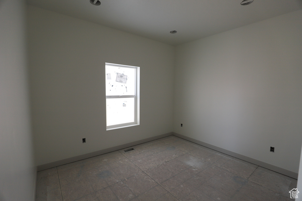 Spare room with tile floors