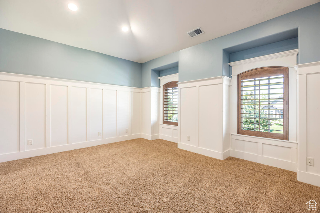 Carpeted empty room with plenty of natural light