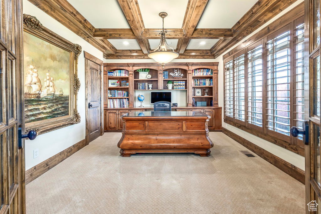 Carpeted home office with beam ceiling and coffered ceiling