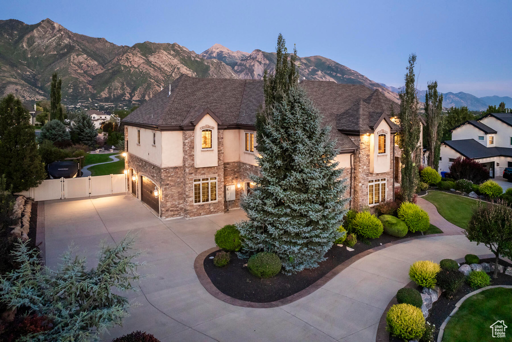 View of front of home featuring a garage and a mountain view