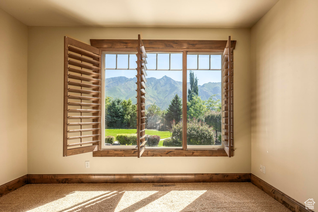 Carpeted spare room with a mountain view