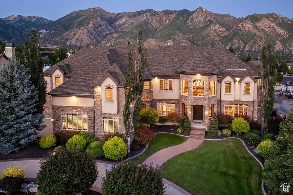 French country inspired facade with a mountain view