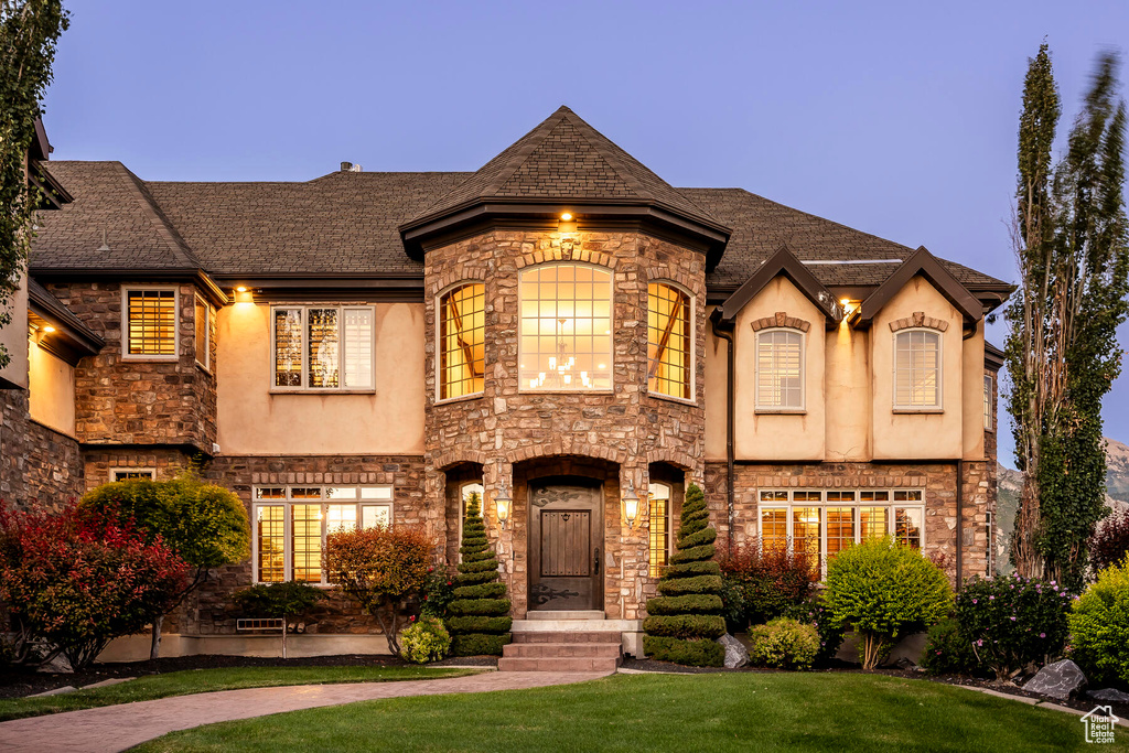 View of front of house with a lawn