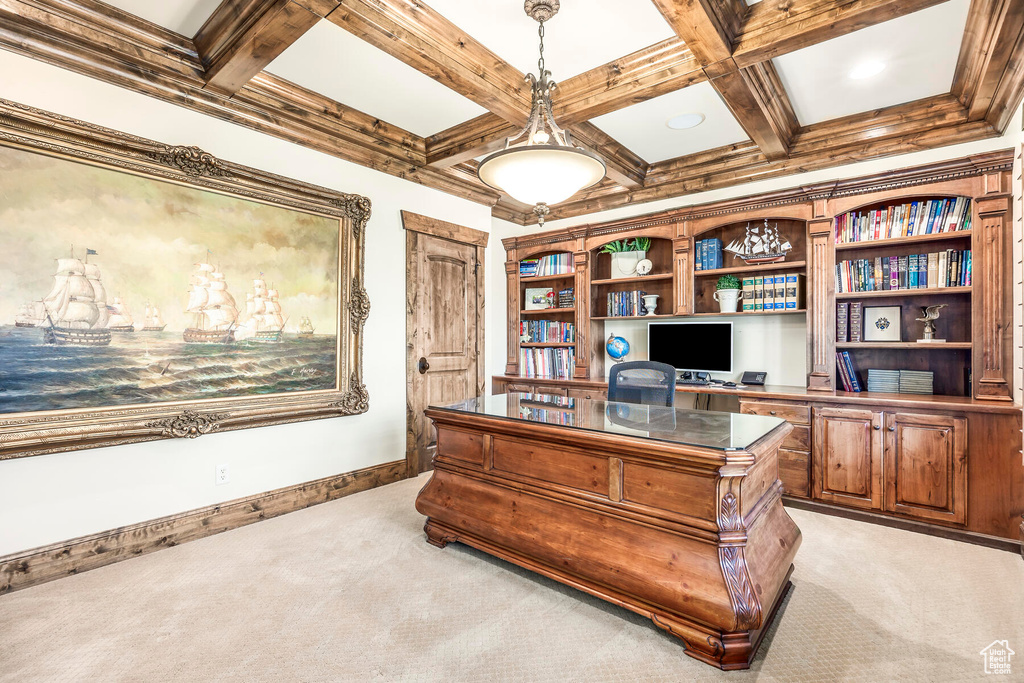 Home office with built in desk, beamed ceiling, light carpet, and coffered ceiling