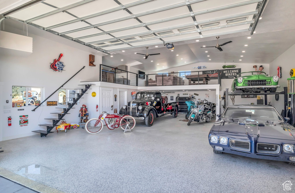 Garage with a garage door opener and ceiling fan