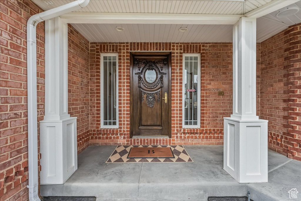 Property entrance with covered porch