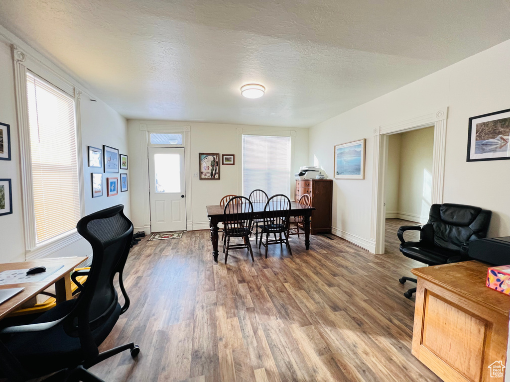 Office with hardwood / wood-style floors