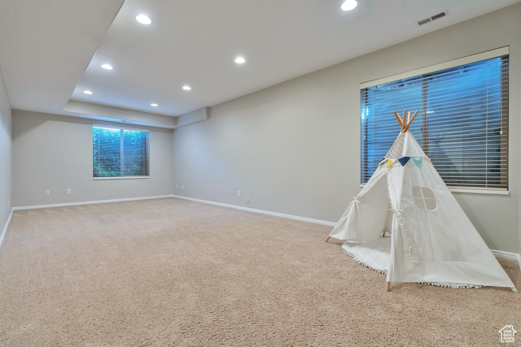 Rec room featuring light colored carpet