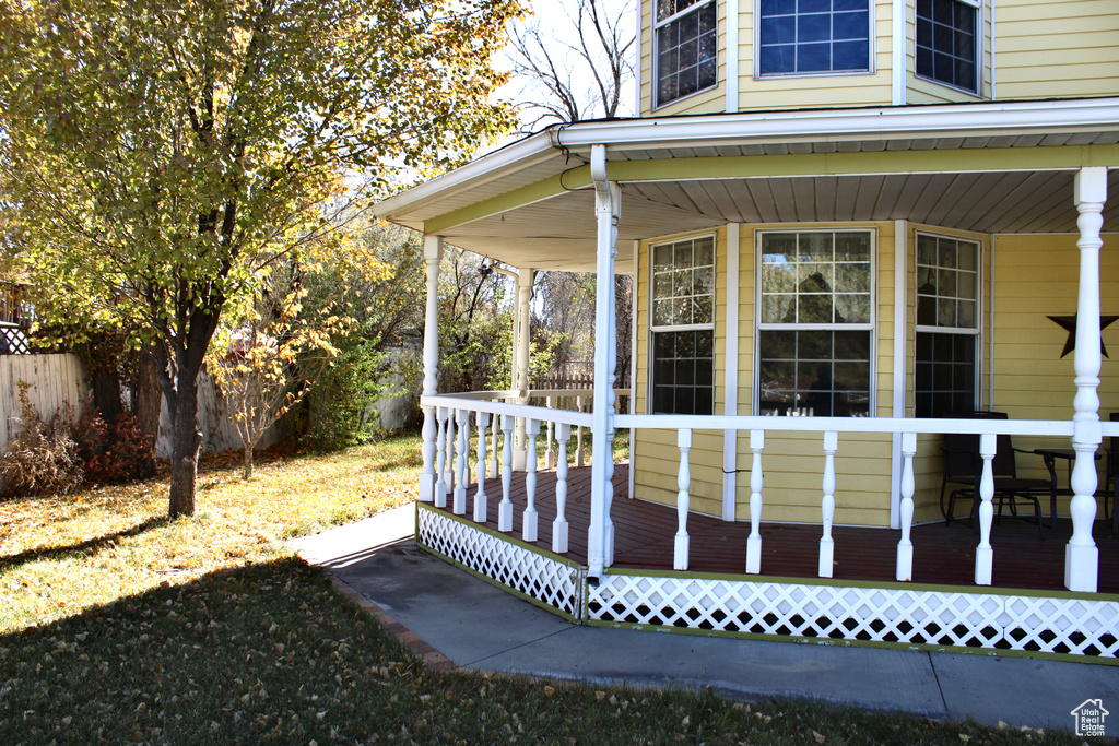 View of side of property with covered porch
