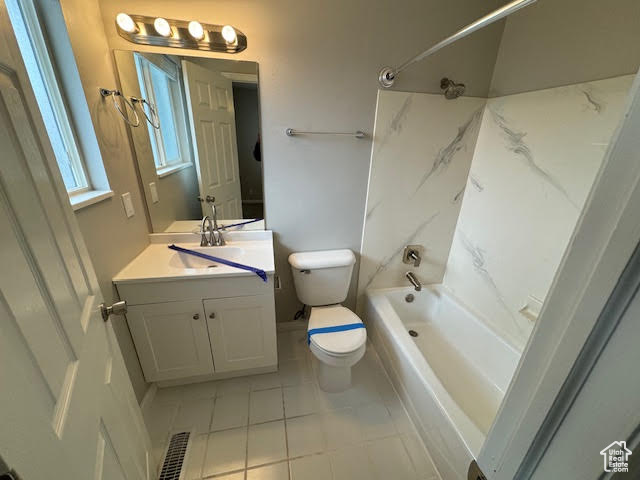 Full bathroom with vanity, toilet, tile flooring, and shower / tub combination