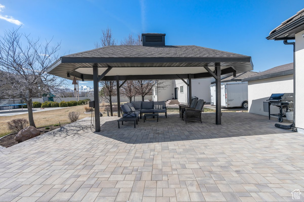 View of terrace featuring an outdoor living space and a gazebo