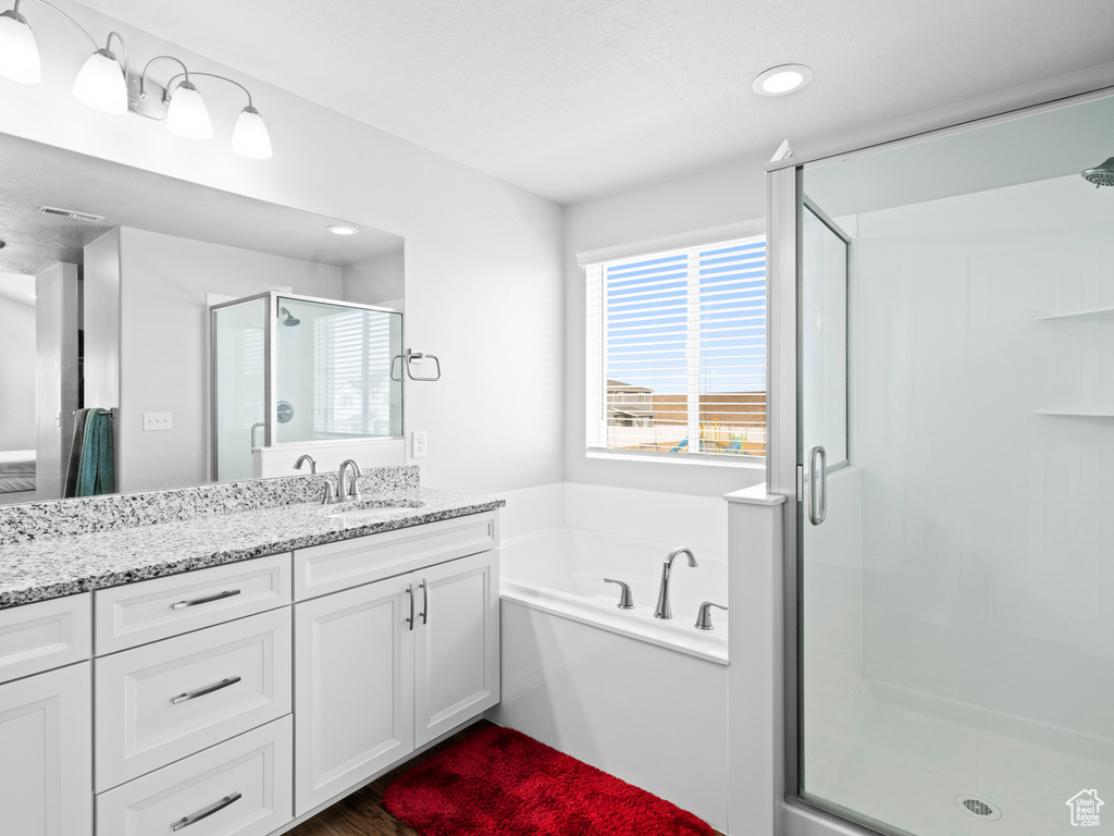 Bathroom with plus walk in shower and vanity