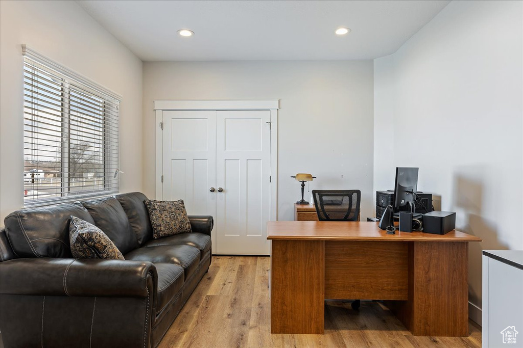Office space featuring light hardwood / wood-style floors