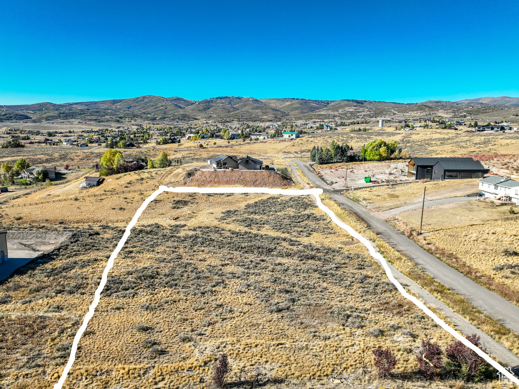 Birds eye view of property with a mountain view and a rural view