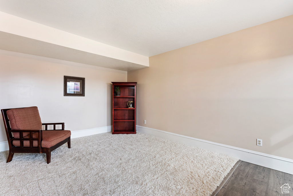 Sitting room with light hardwood / wood-style floors