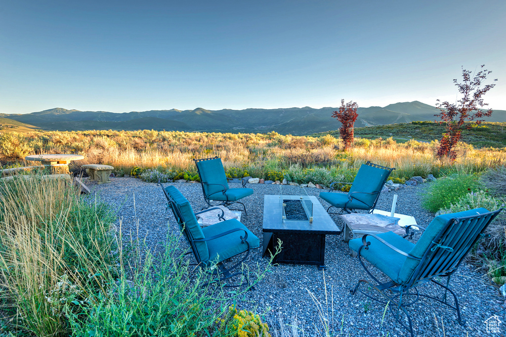 View of terrace with a mountain view and a fire pit