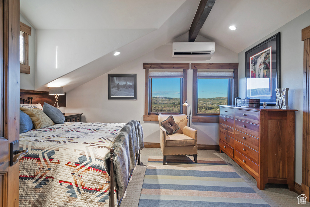 Bedroom with light carpet, vaulted ceiling with beams, and a wall mounted AC