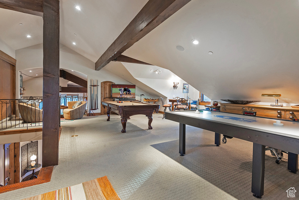 Playroom featuring light carpet, vaulted ceiling with beams, and billiards