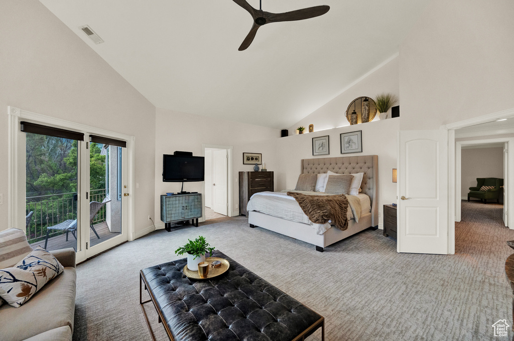 Carpeted bedroom with access to exterior, high vaulted ceiling, and ceiling fan
