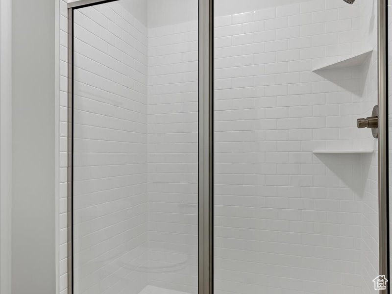 Interior details with a shower with shower door