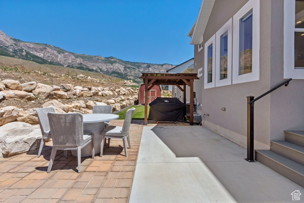 View of patio / terrace featuring a mountain view and area for grilling