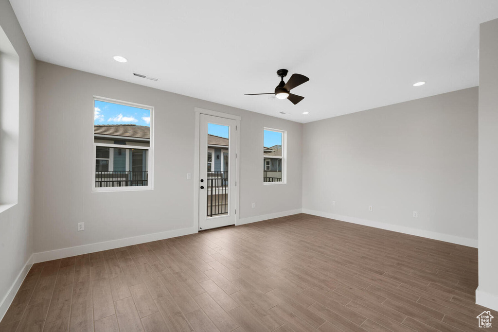 Unfurnished room with wood-type flooring and ceiling fan