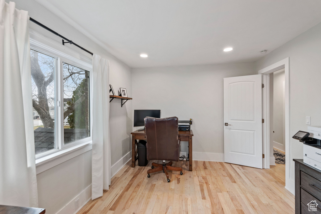 Office featuring plenty of natural light and light hardwood / wood-style floors