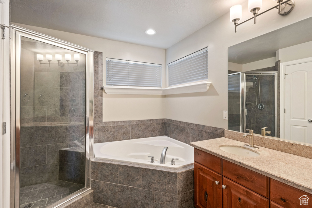 Bathroom with oversized vanity and plus walk in shower