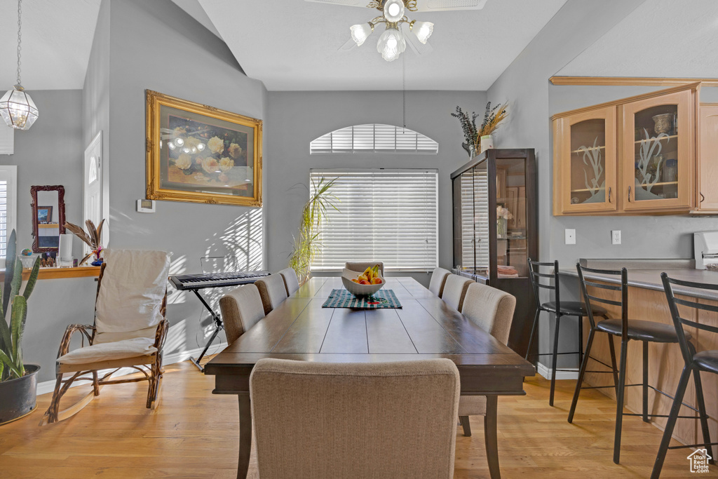 Dining area with ceiling fan and light hardwood / wood-style floors