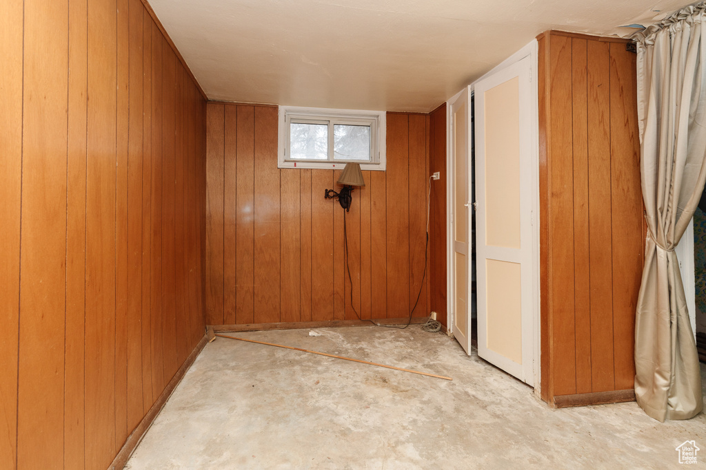 Spare room with wood walls