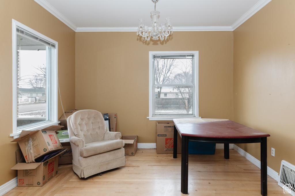 Office space featuring a wealth of natural light, a chandelier, and crown molding