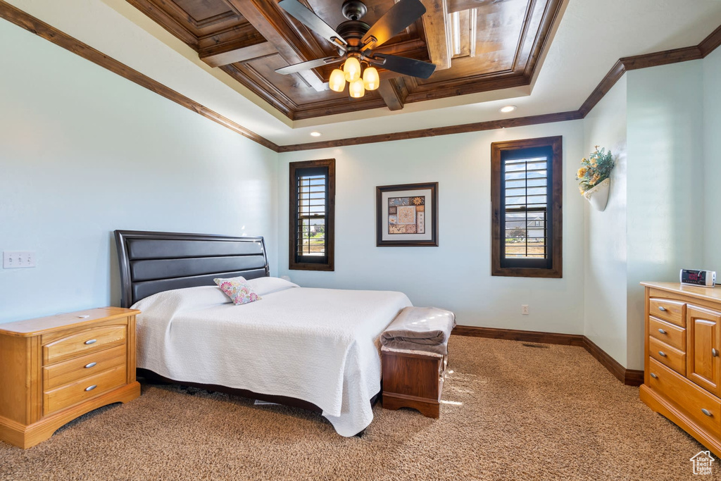 Bedroom with crown molding, carpet flooring, multiple windows, and ceiling fan