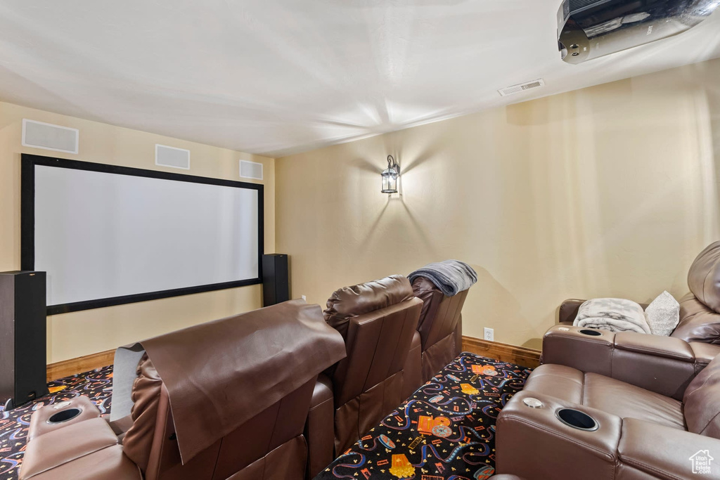 Cinema room featuring hardwood / wood-style flooring