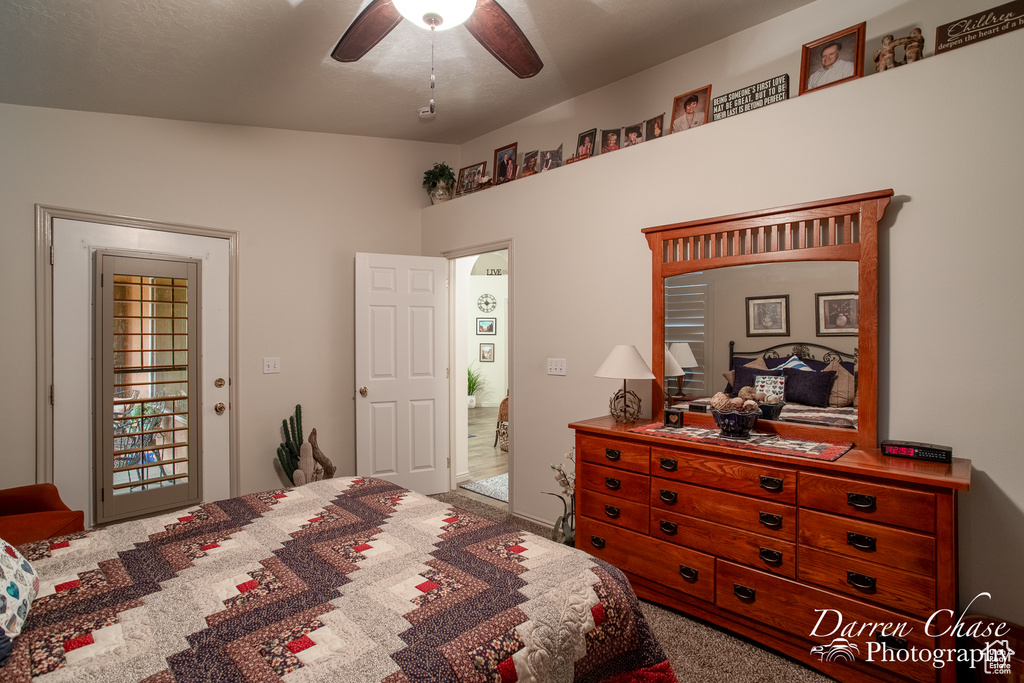 Bedroom with carpet flooring, lofted ceiling, and ceiling fan
